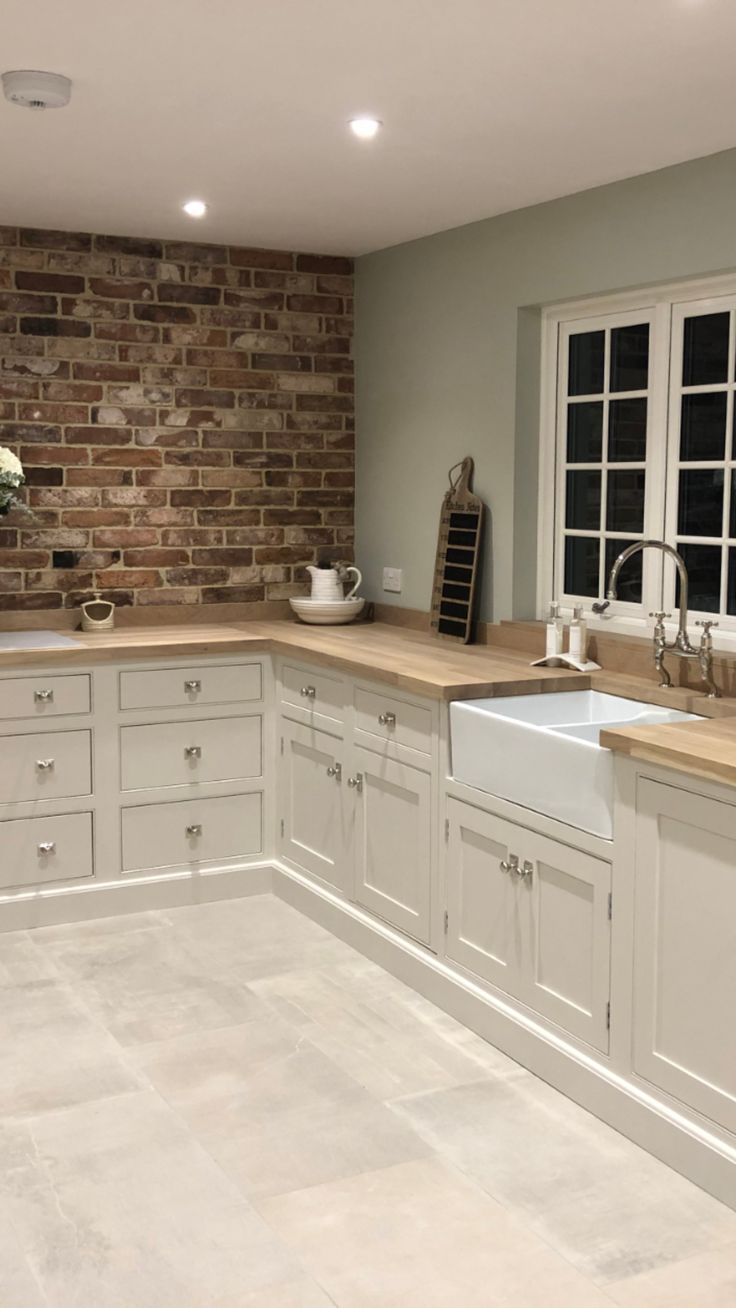 Traditional country feel cream kitchen with beaded cabinets, double oven and large larder